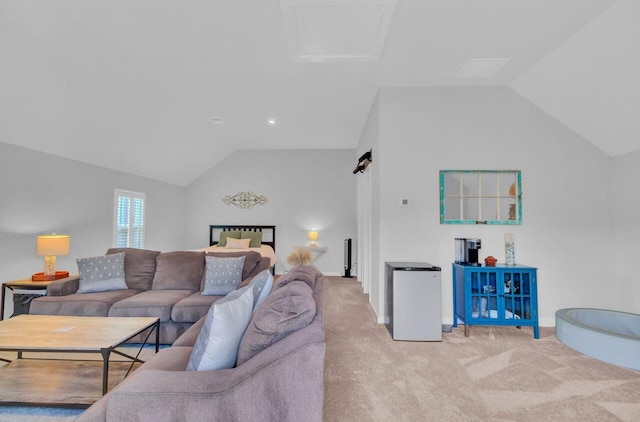 living room featuring light colored carpet and vaulted ceiling