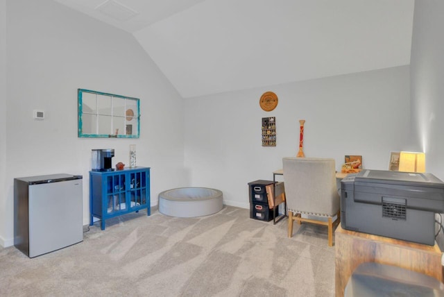 miscellaneous room featuring light carpet and lofted ceiling