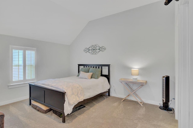 bedroom featuring carpet and lofted ceiling