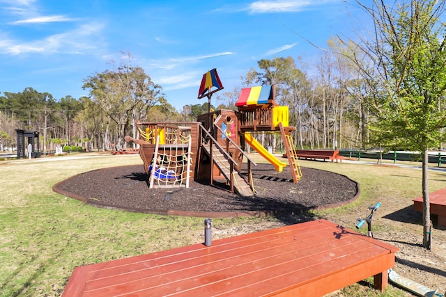 view of playground with a lawn