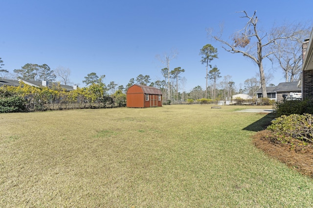 view of yard with an outbuilding and a shed