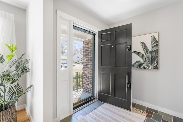 foyer entrance with baseboards