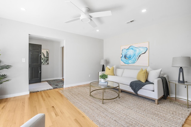 living area with visible vents, a ceiling fan, wood finished floors, recessed lighting, and baseboards