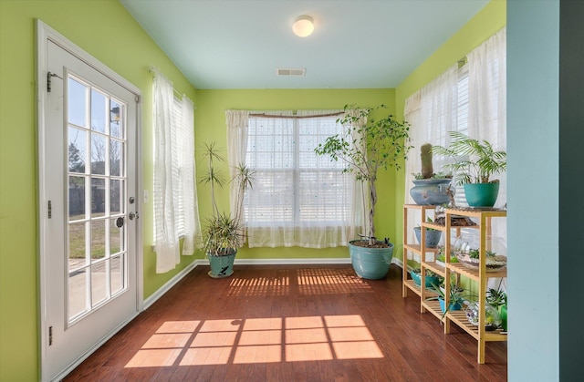 sunroom featuring a healthy amount of sunlight and visible vents