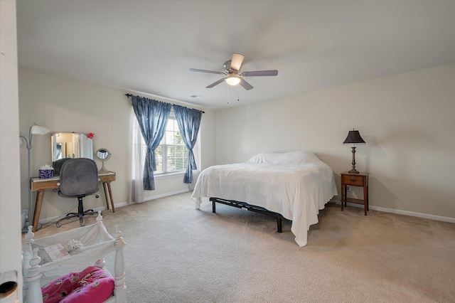 bedroom with carpet, ceiling fan, and baseboards