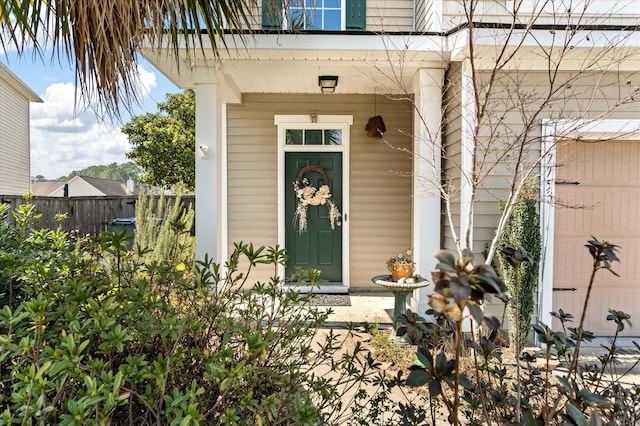 entrance to property featuring fence