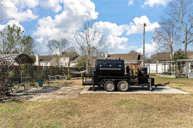 view of yard with fence, a pergola, a playground, and a patio