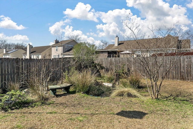 view of yard with a fenced backyard