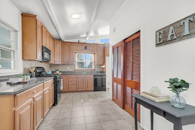 kitchen featuring black appliances, sink, tasteful backsplash, light tile patterned floors, and beamed ceiling