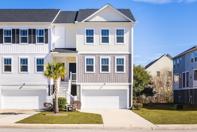 view of front facade with a garage and a front yard