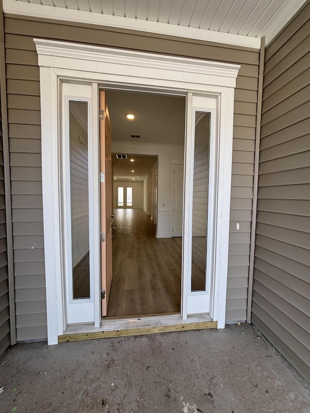 entrance to property featuring visible vents