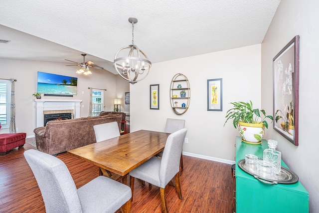 2016 Wild Flower Ln, Charleston, SC 29414 - dining area with a chandelier, wood finished floors, ceiling fan, baseboards, and a fireplace