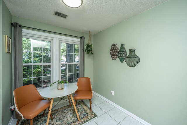 2016 Wild Flower Ln, Charleston, SC 29414 - sitting room featuring a textured ceiling, baseboards, and light tile patterned floors