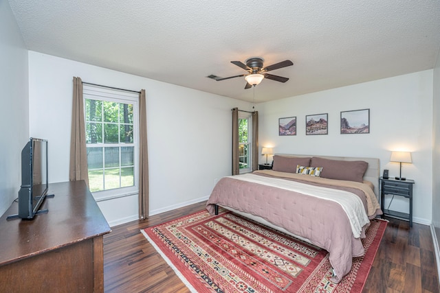 2016 Wild Flower Ln, Charleston, SC 29414 - bedroom with dark wood finished floors, baseboards, a textured ceiling, and ceiling fan