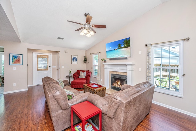 2016 Wild Flower Ln, Charleston, SC 29414 - living area featuring vaulted ceiling, a fireplace, wood finished floors, a ceiling fan, and baseboards