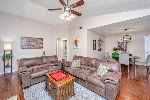 2016 Wild Flower Ln, Charleston, SC 29414 - living area with vaulted ceiling, wood finished floors, a chandelier, a ceiling fan, and baseboards