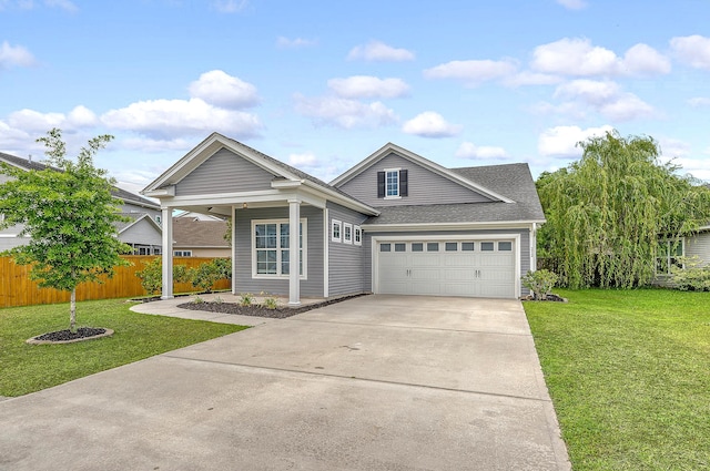 view of front of house with concrete driveway, an attached garage, and a shingled roof