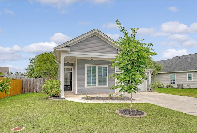 view of front facade with driveway, central air condition unit, and a garage