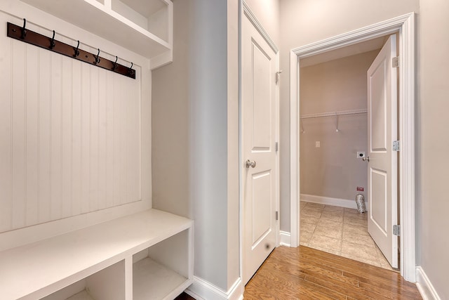 mudroom featuring wood finished floors and baseboards