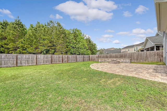 view of yard with a patio and a fire pit