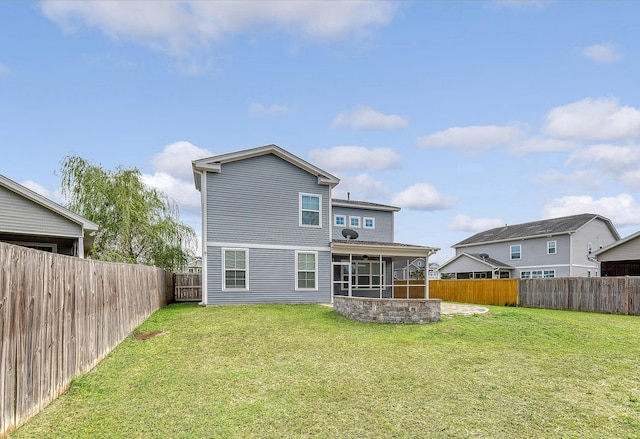 back of house with a sunroom and a ceiling fan