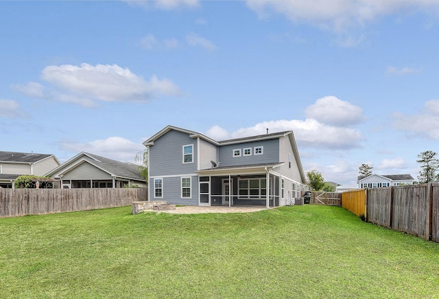 back of property featuring a sunroom, a patio, and a gate