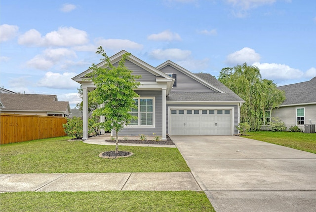 ranch-style house featuring an attached garage, concrete driveway, and a shingled roof