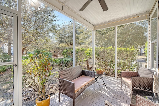 sunroom featuring a wealth of natural light and ceiling fan