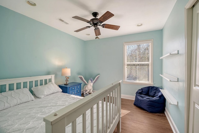 bedroom with ceiling fan and light wood-type flooring