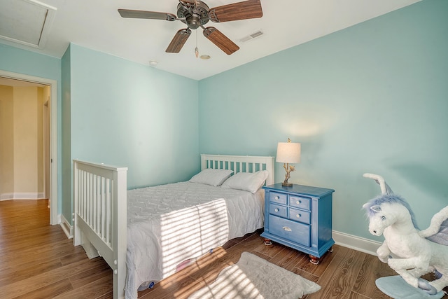 bedroom with ceiling fan and dark wood-type flooring