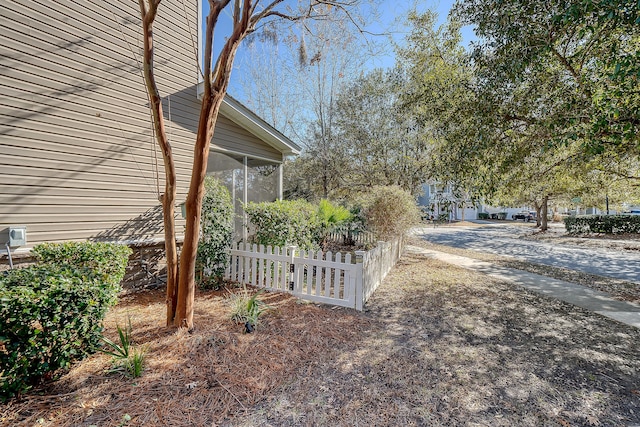 view of yard with a sunroom