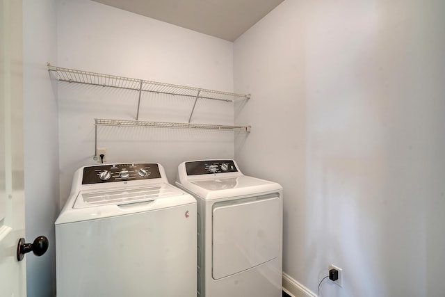 laundry area with independent washer and dryer