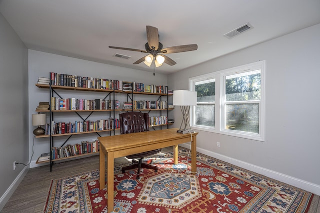 home office with visible vents, baseboards, and wood finished floors