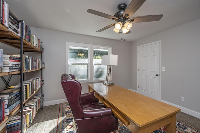 office space with ceiling fan, baseboards, and wood finished floors