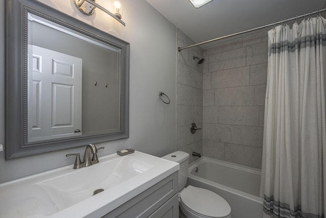 full bathroom featuring vanity, toilet, and shower / tub combo with curtain