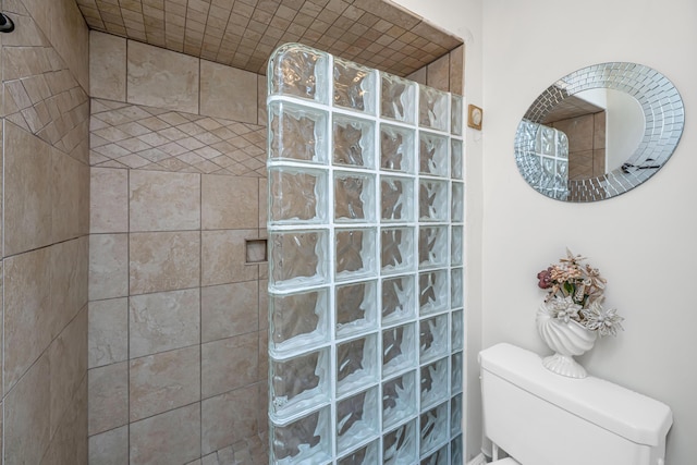 bathroom with tiled shower