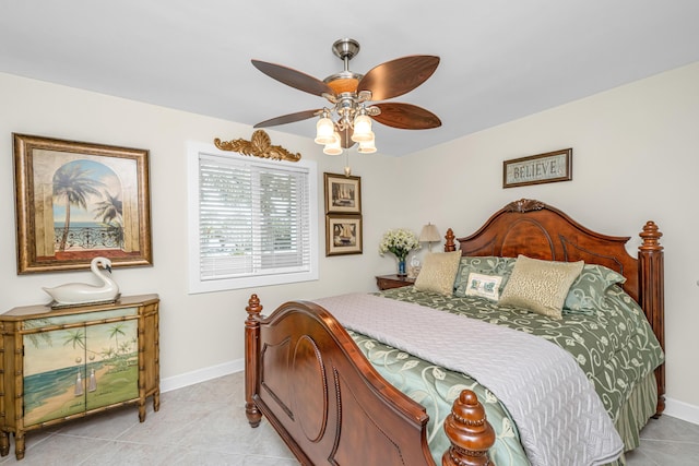 tiled bedroom with ceiling fan