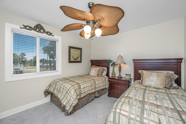 tiled bedroom with ceiling fan