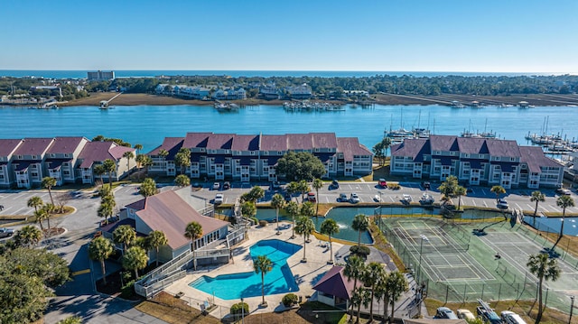 birds eye view of property with a water view