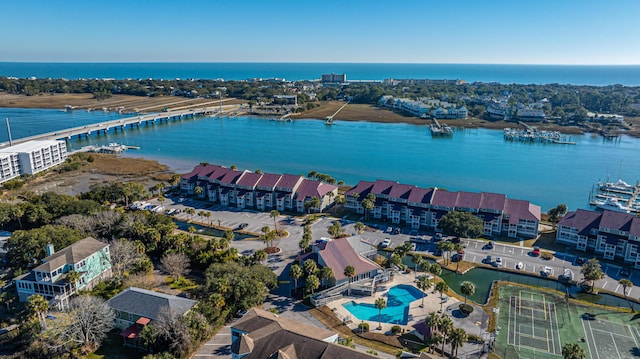 birds eye view of property with a water view