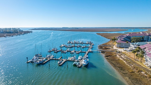 aerial view with a water view and a beach view