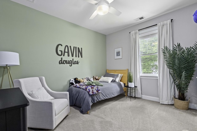 bedroom with baseboards, ceiling fan, carpet flooring, and visible vents