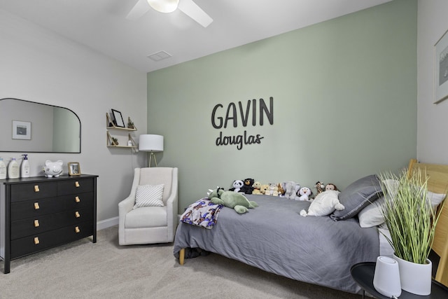bedroom featuring baseboards, ceiling fan, and carpet