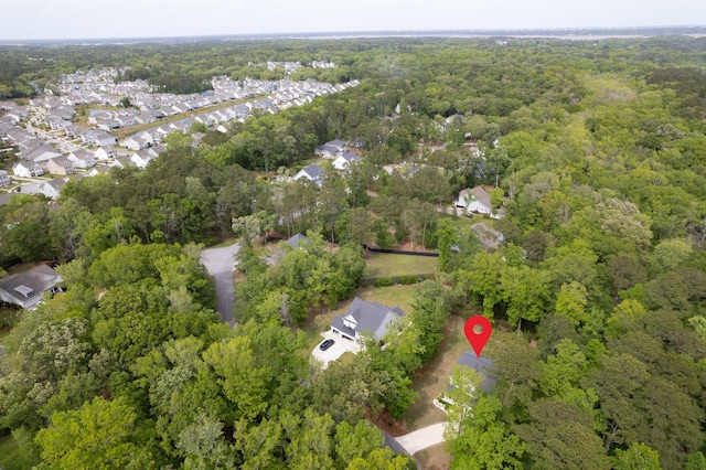 bird's eye view featuring a residential view and a forest view