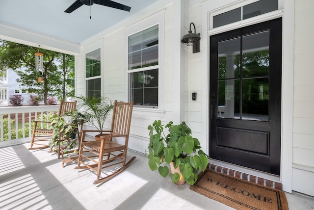 doorway to property with a ceiling fan and a porch