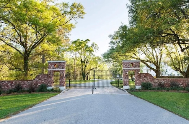 view of street featuring a gate and a gated entry
