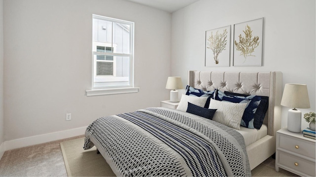 carpeted bedroom with baseboards