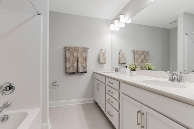 full bath with double vanity, tile patterned flooring, visible vents, and a sink