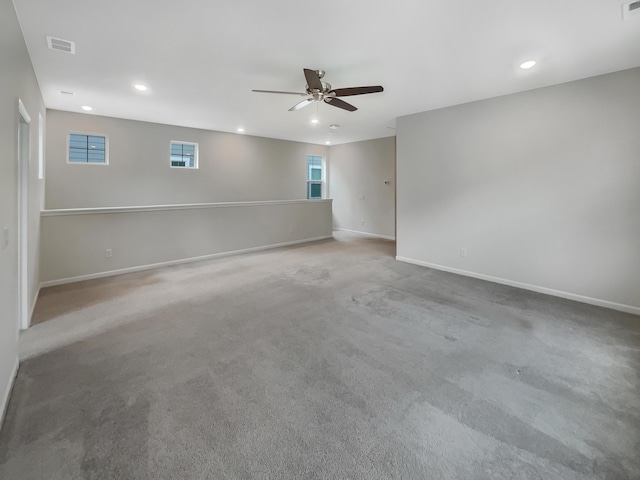 unfurnished room featuring carpet and ceiling fan