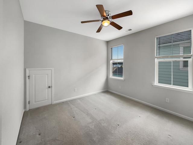 carpeted empty room with ceiling fan